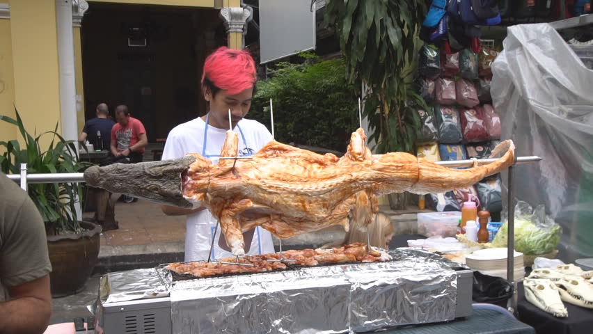 Crocodile meat in Thailand being grilled for people to eat crocodile meat
